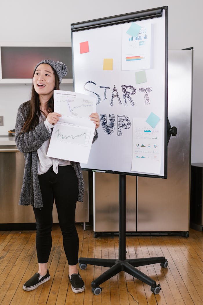 A girl showing a graph for start-up business